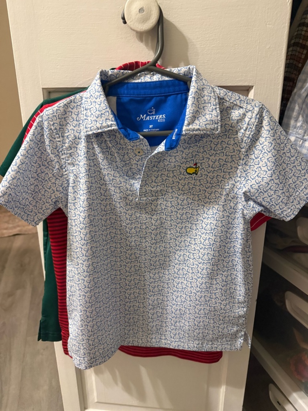 Masters White Polo with Blue Print and Yellow Chest Emblem